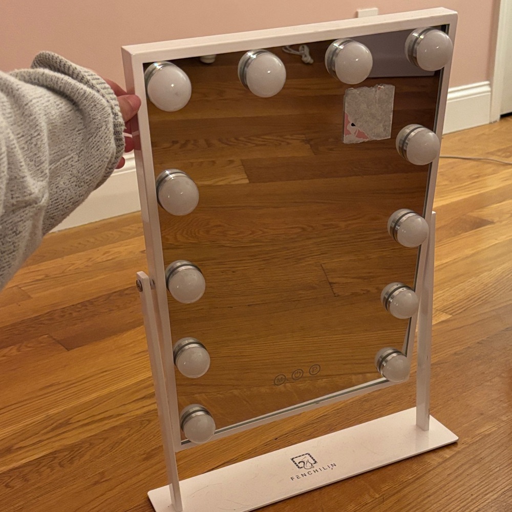 Makeup Mirror. Comes with plug in for the lights. NEVER USED.Will ship with care